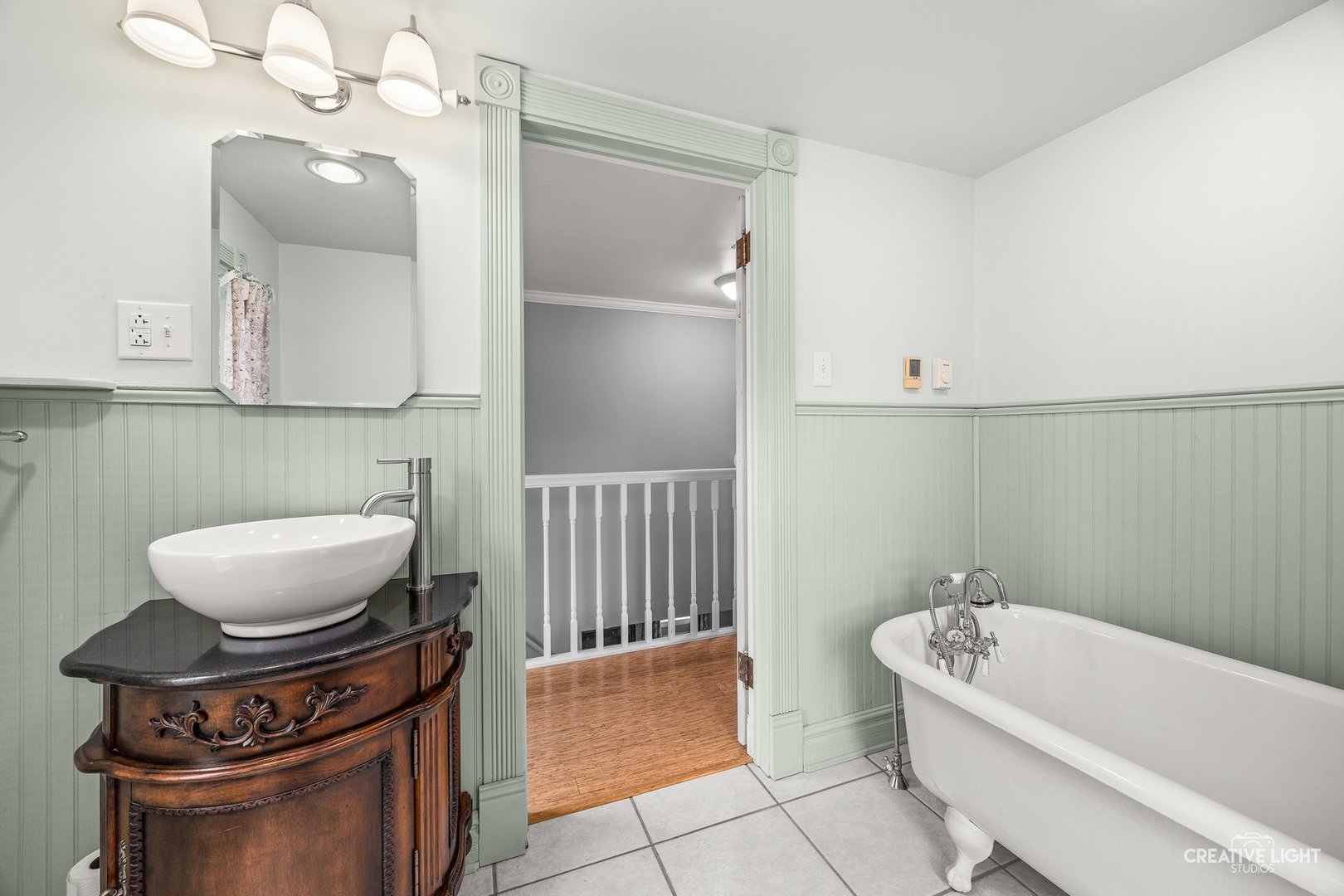 209 North Shabbona Road Shabbona, IL 60550 - Photo 17 of 25 a bathroom with a toilet a sink and bathtub