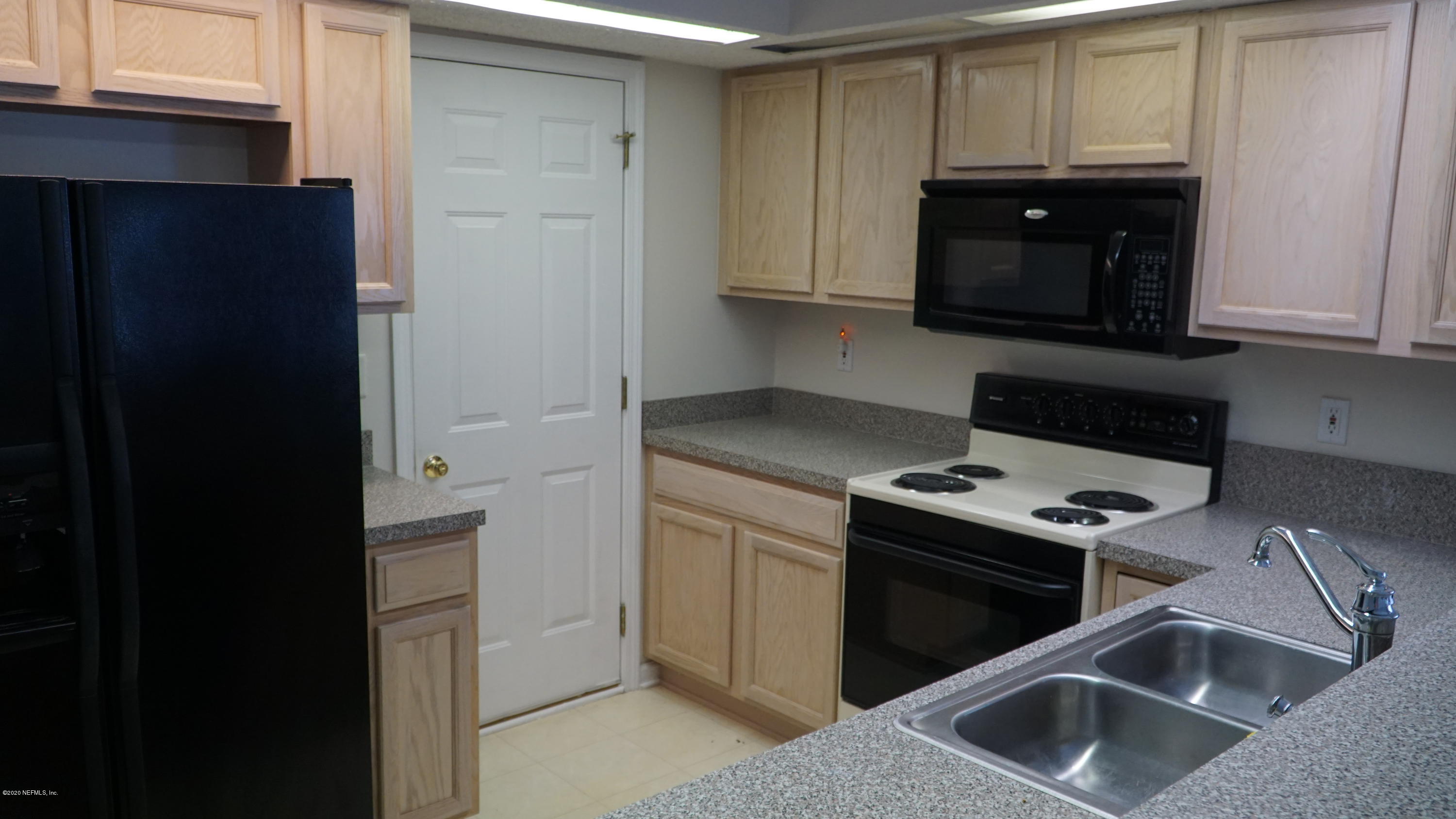 1144 Creeks Ridge Road Jacksonville, FL 32225 - Photo 13 of 31 Kitchen and Garage Entry