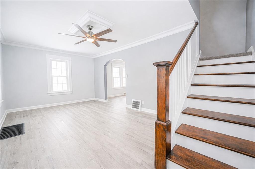 671 Old Rte 8 Harrisville, PA 16038 - Photo 14 of 49 a view of a livingroom with wooden floor and a ceiling fan