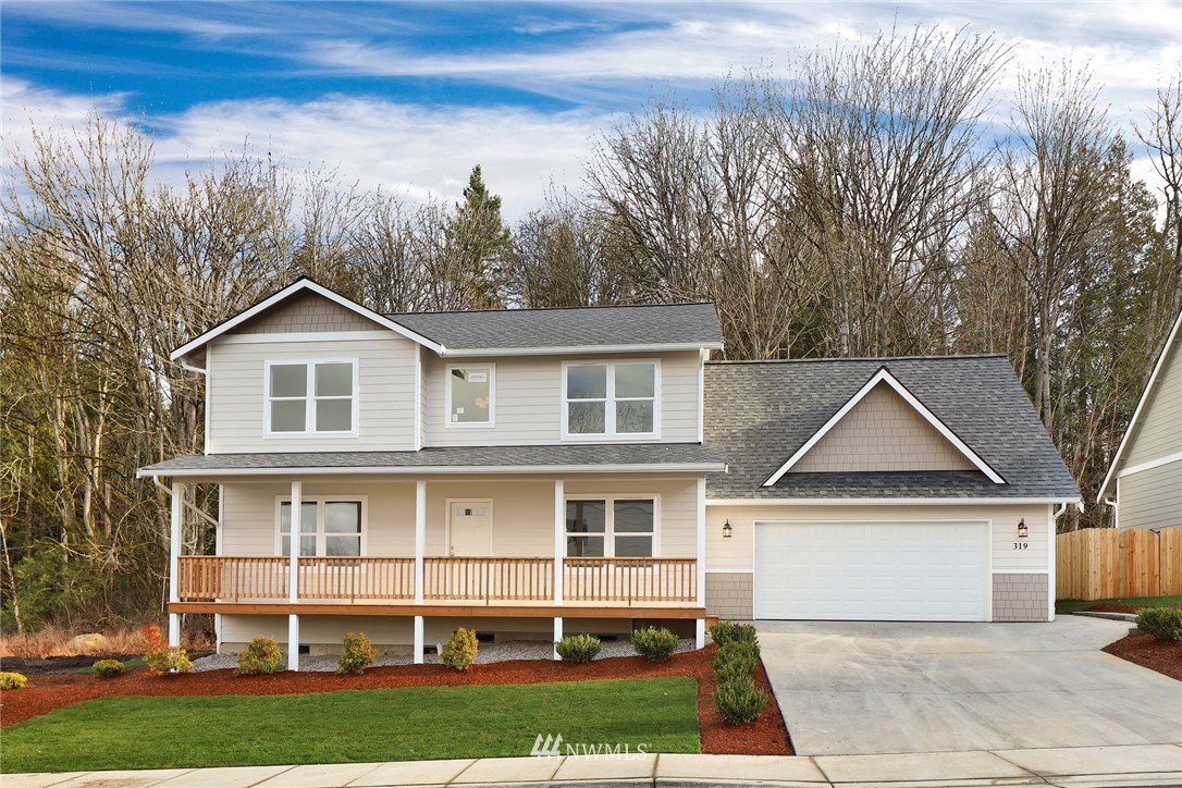 a view of house with yard