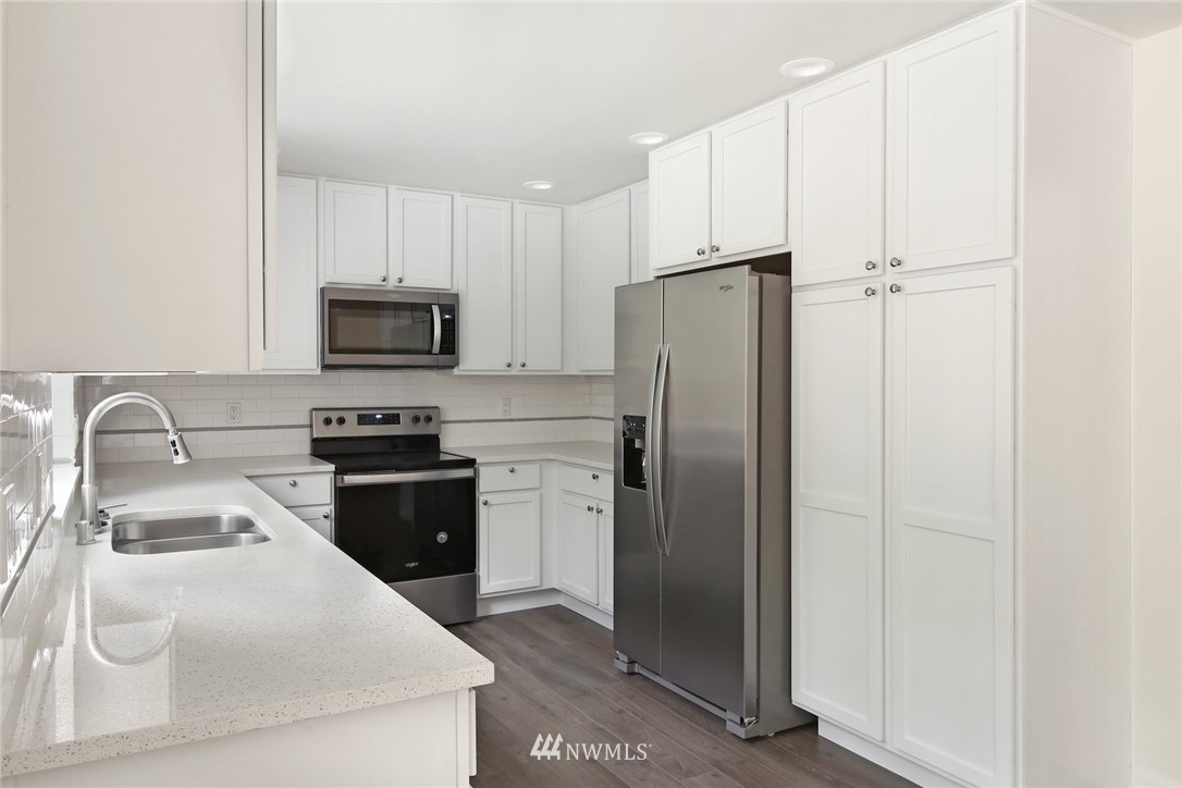 319 Whitetail Loop Blaine, WA 98230 - Photo 14 of 40 a kitchen with stainless steel appliances a refrigerator stove and sink