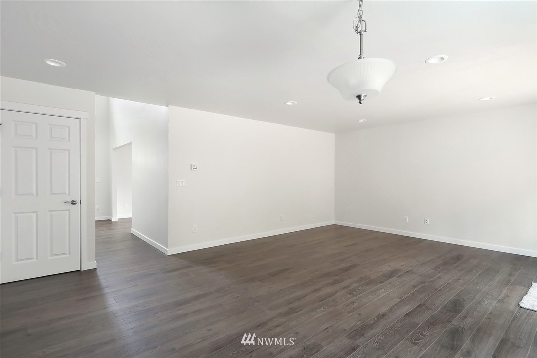 319 Whitetail Loop Blaine, WA 98230 - Photo 20 of 40 a view of an empty room with wooden floor and a window