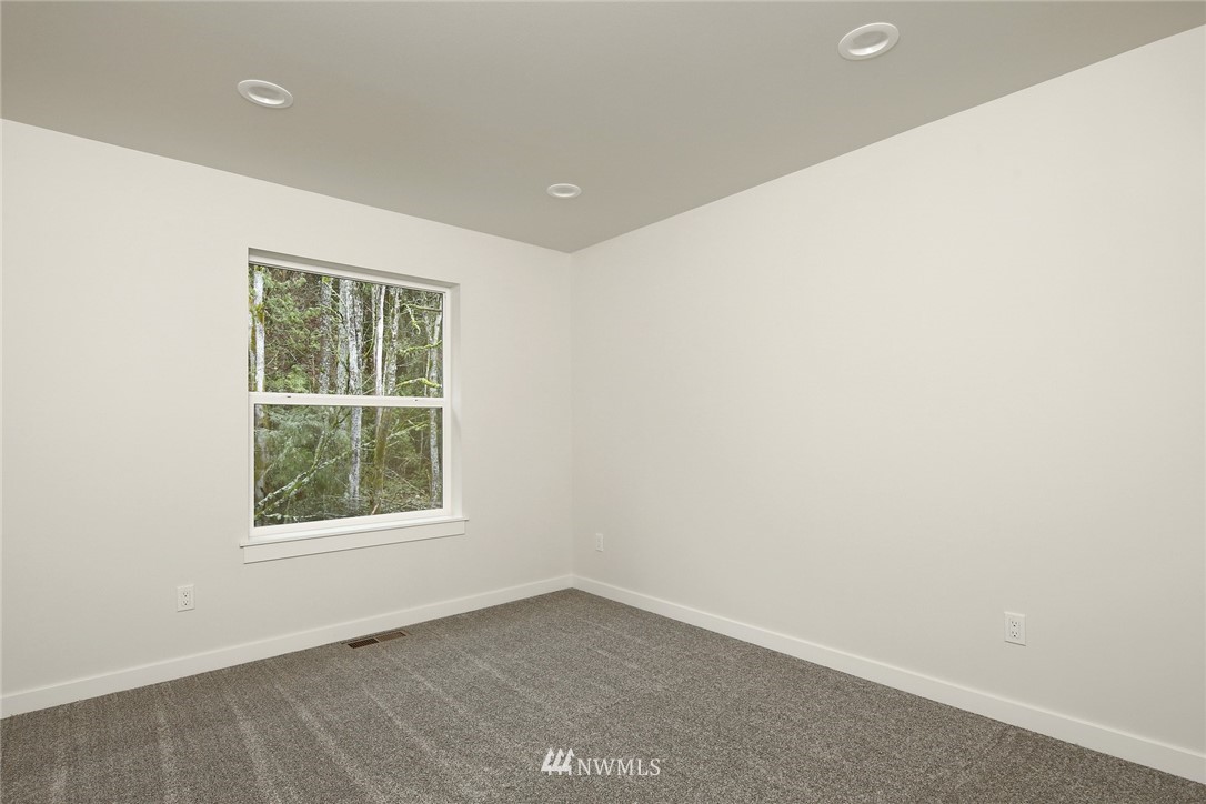 319 Whitetail Loop Blaine, WA 98230 - Photo 22 of 40 an empty room with a window