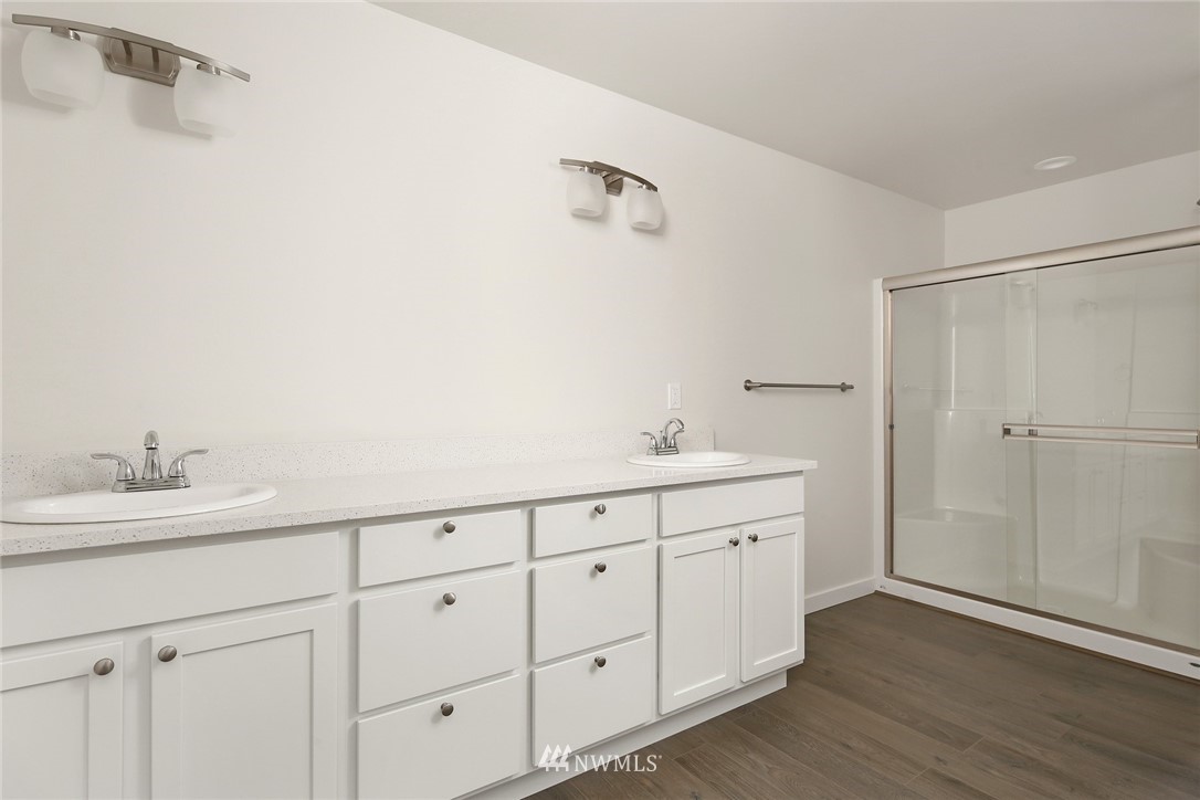 319 Whitetail Loop Blaine, WA 98230 - Photo 23 of 40 a bathroom with a double vanity sink and mirror