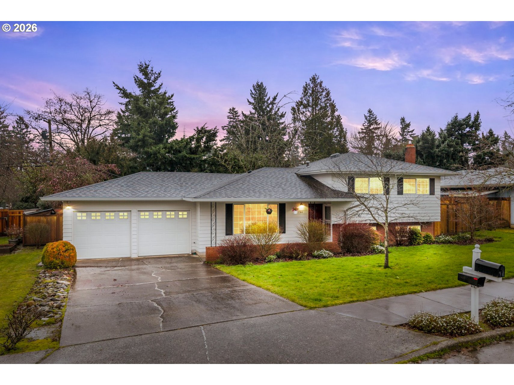 1744 Northeast 153rd Place Portland, OR 97230 - Photo 1 of 33 a front view of a house with a yard and garage