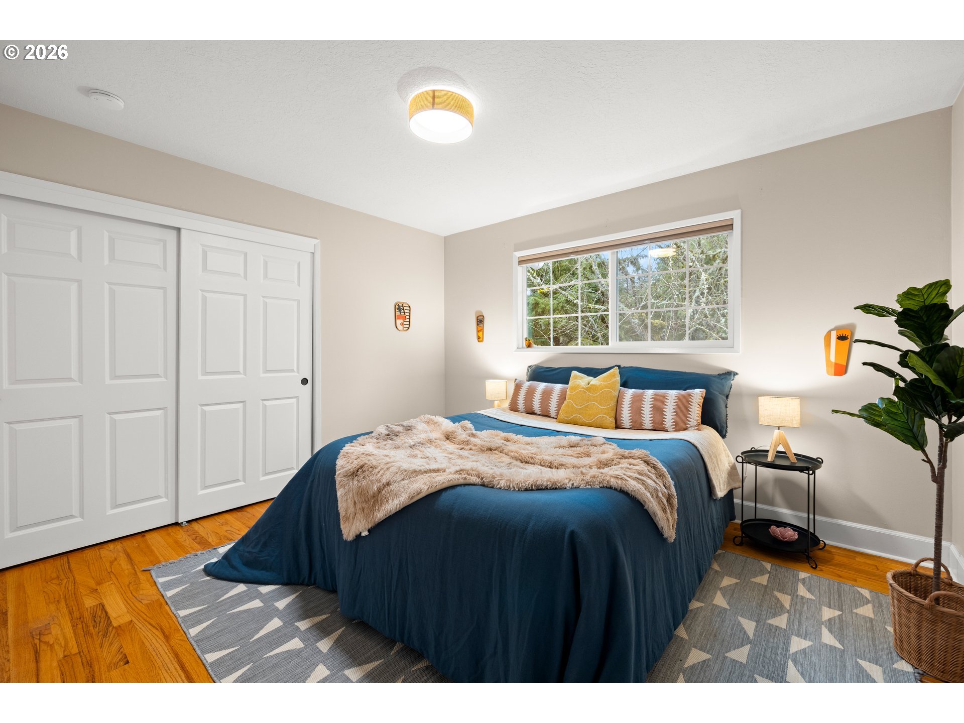 1744 Northeast 153rd Place Portland, OR 97230 - Photo 15 of 33 a bedroom with a bed and a lamp
