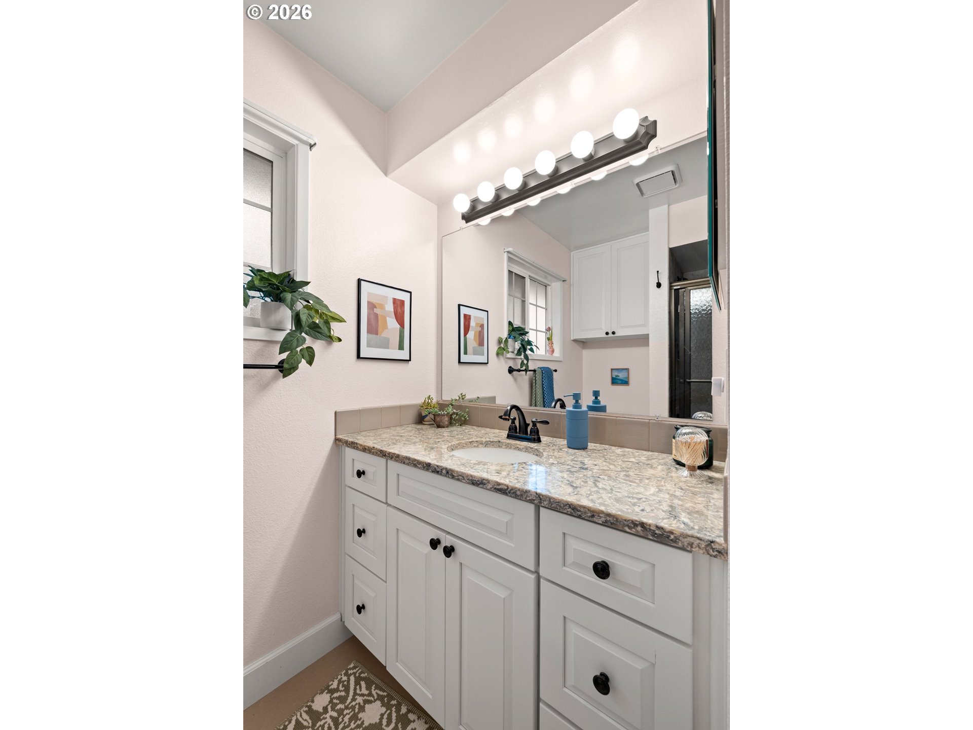 1744 Northeast 153rd Place Portland, OR 97230 - Photo 17 of 33 a en suite bathroom with a granite countertop sink and a mirror