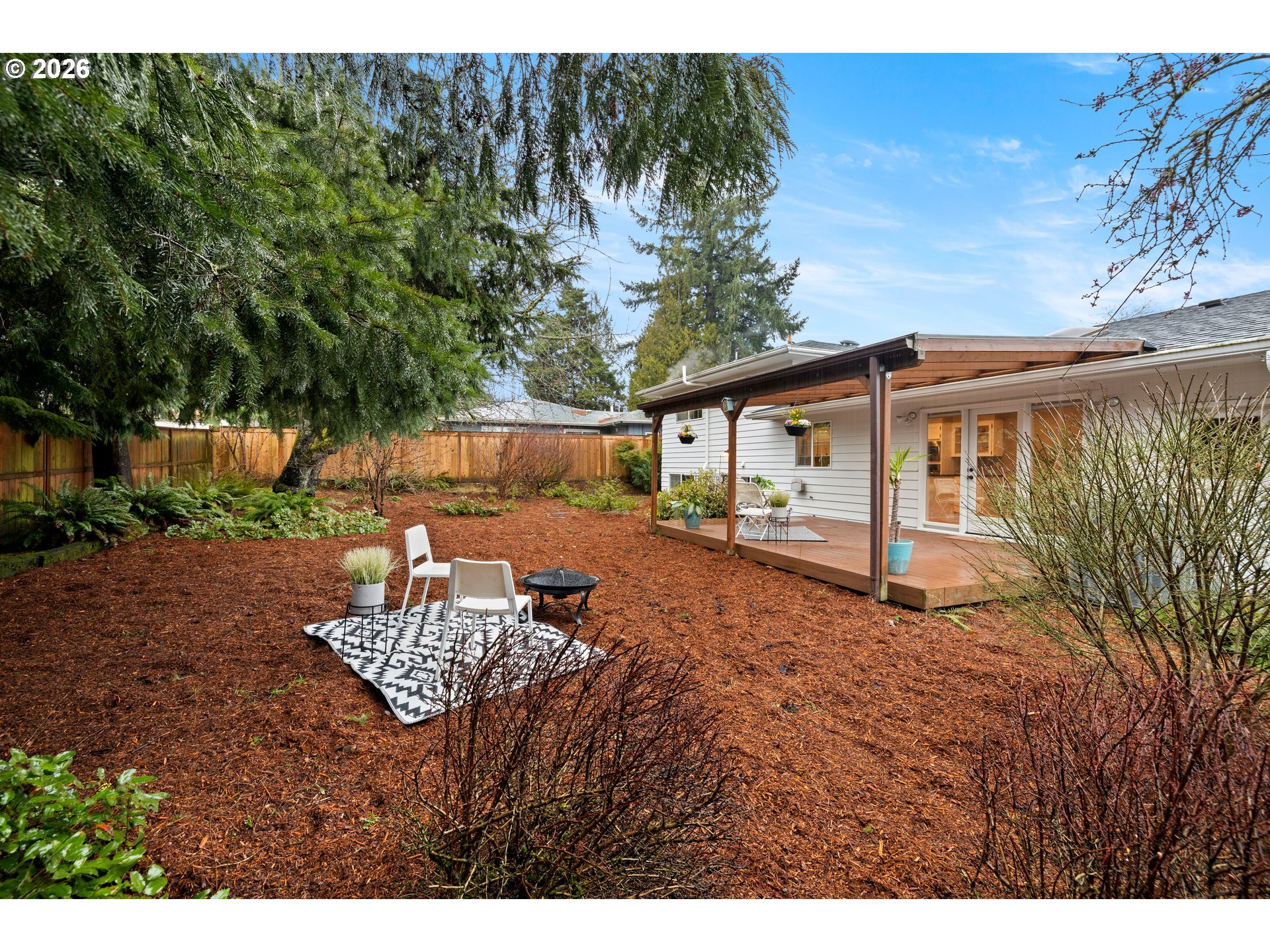 1744 Northeast 153rd Place Portland, OR 97230 - Photo 28 of 33 a backyard of a house with table and chairs
