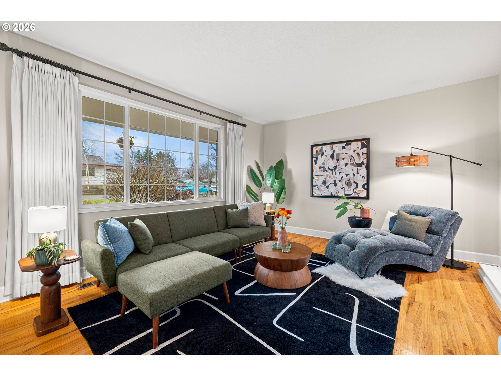 1744 Northeast 153rd Place Portland, OR 97230 - Photo 5 of 33 a living room with furniture a rug and a large window