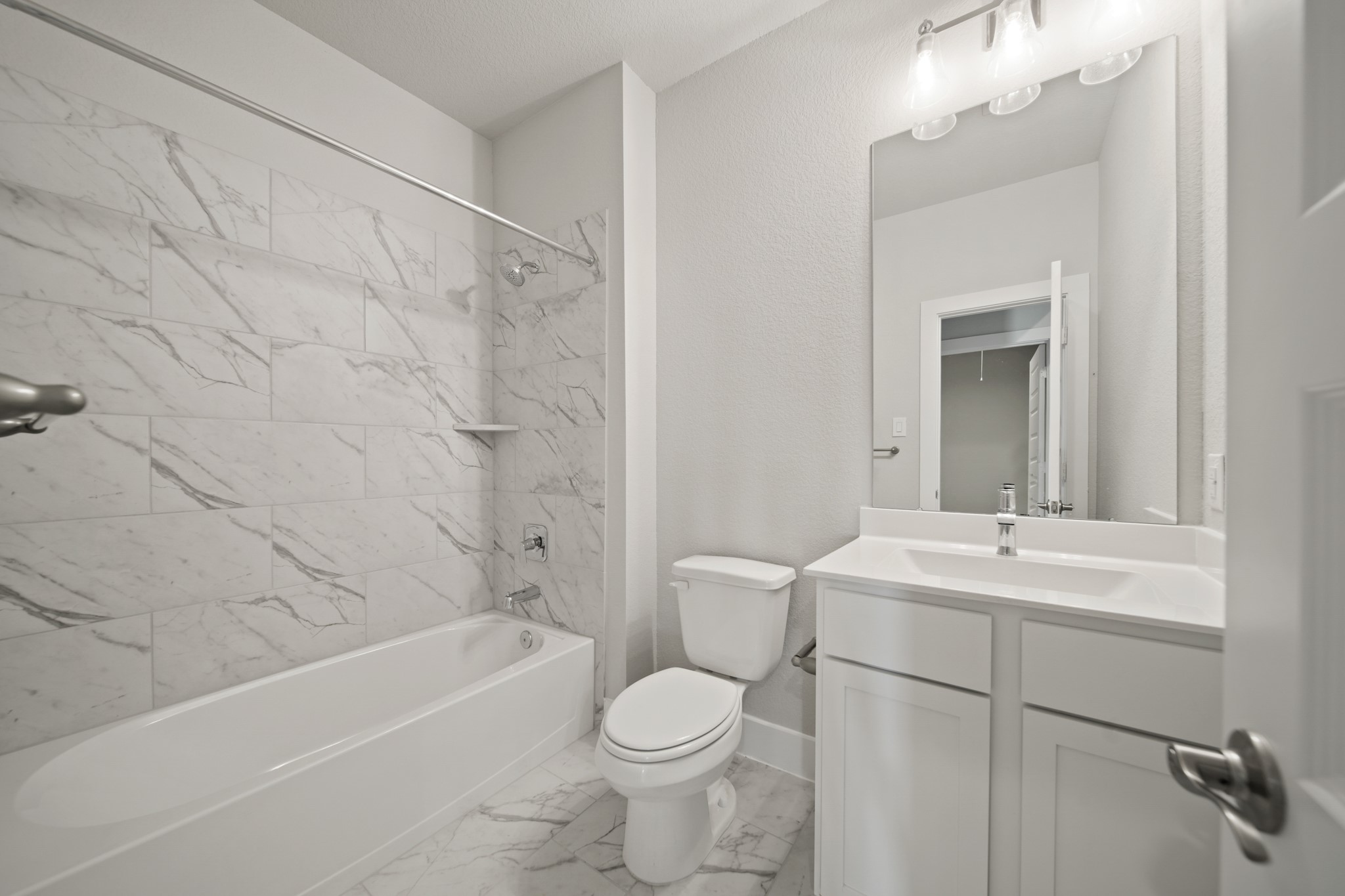 405 Hampton Edge Lane Waller, TX 77484 - Photo 22 of 45 a bathroom with a sink a toilet and shower
