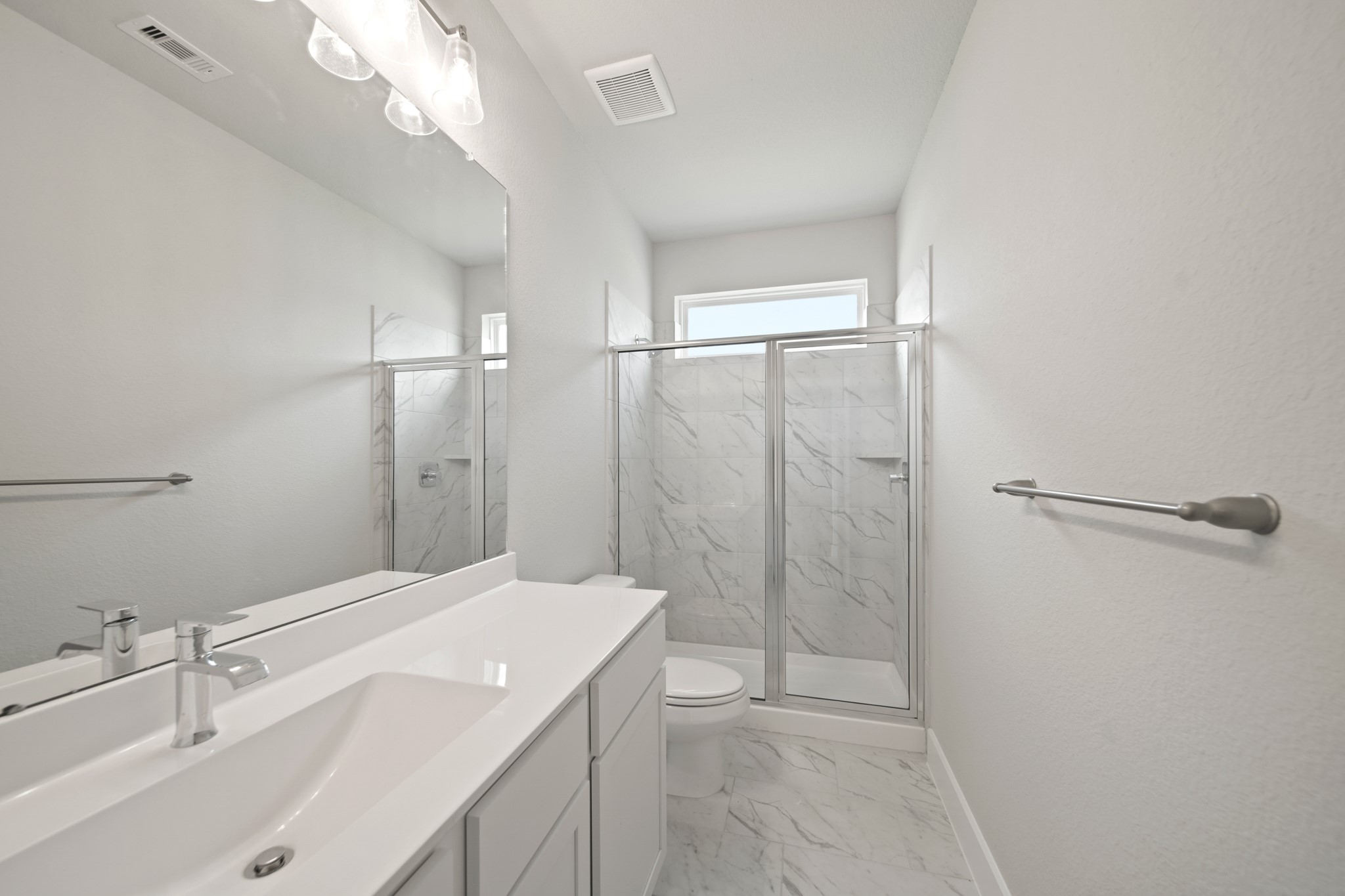 405 Hampton Edge Lane Waller, TX 77484 - Photo 25 of 45 a bathroom with a sink a shower and a mirror