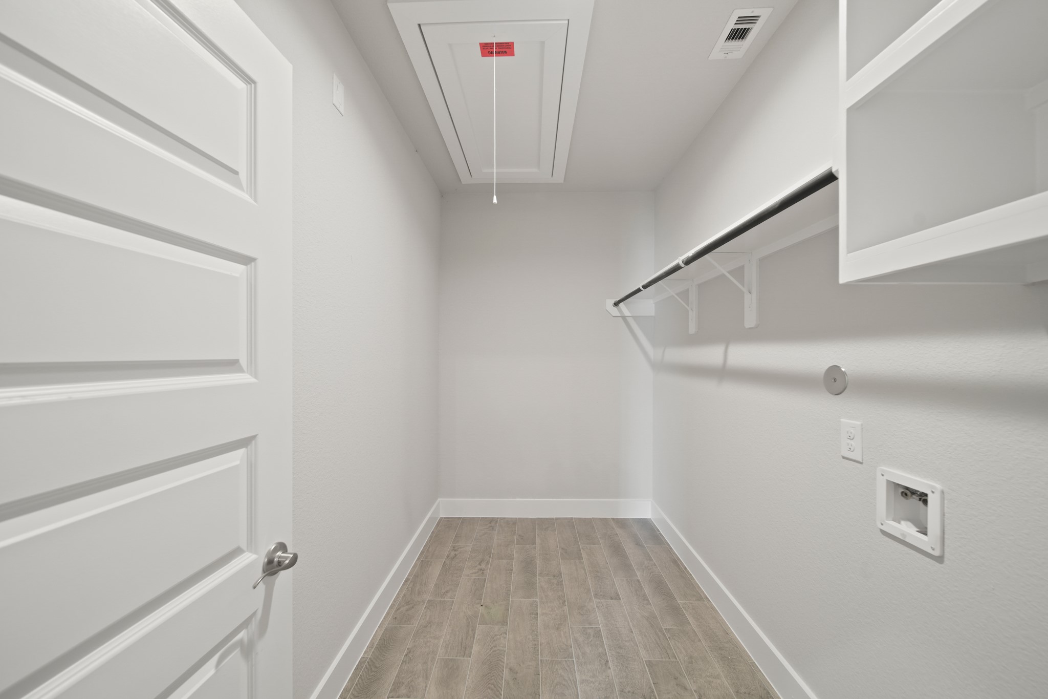 405 Hampton Edge Lane Waller, TX 77484 - Photo 26 of 45 a view of small space with racks on the wall