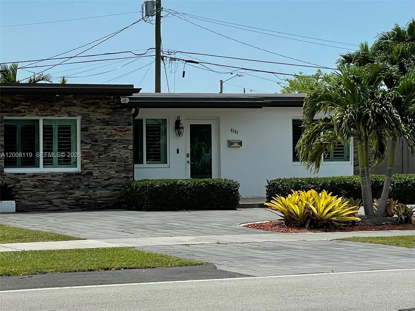 4161 Southwest 102nd Avenue Miami, FL 33165 - Photo 1 of 33 a view of a house with a balcony