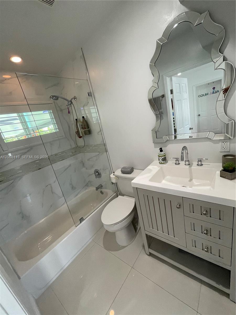 4161 Southwest 102nd Avenue Miami, FL 33165 - Photo 20 of 33 a bathroom with a sink a toilet and shower