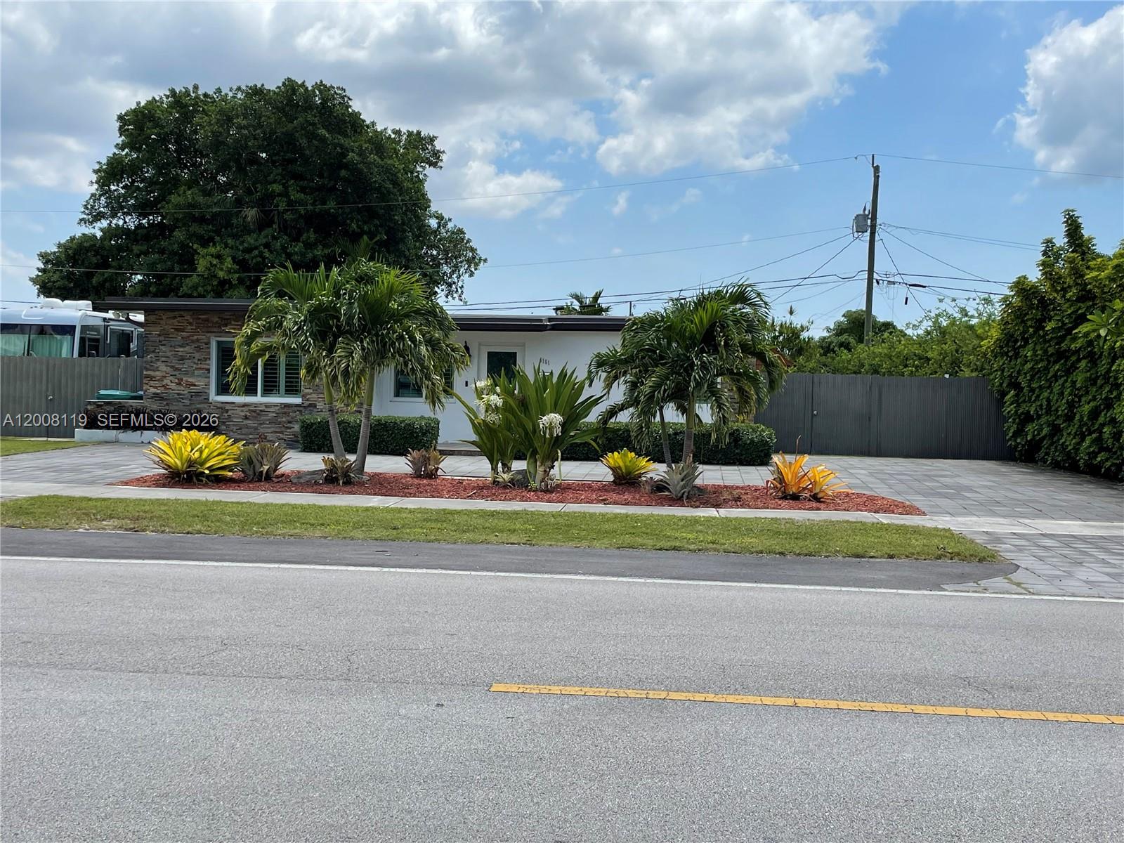 4161 Southwest 102nd Avenue Miami, FL 33165 - Photo 2 of 33 a view of a house with a big yard and a large trees