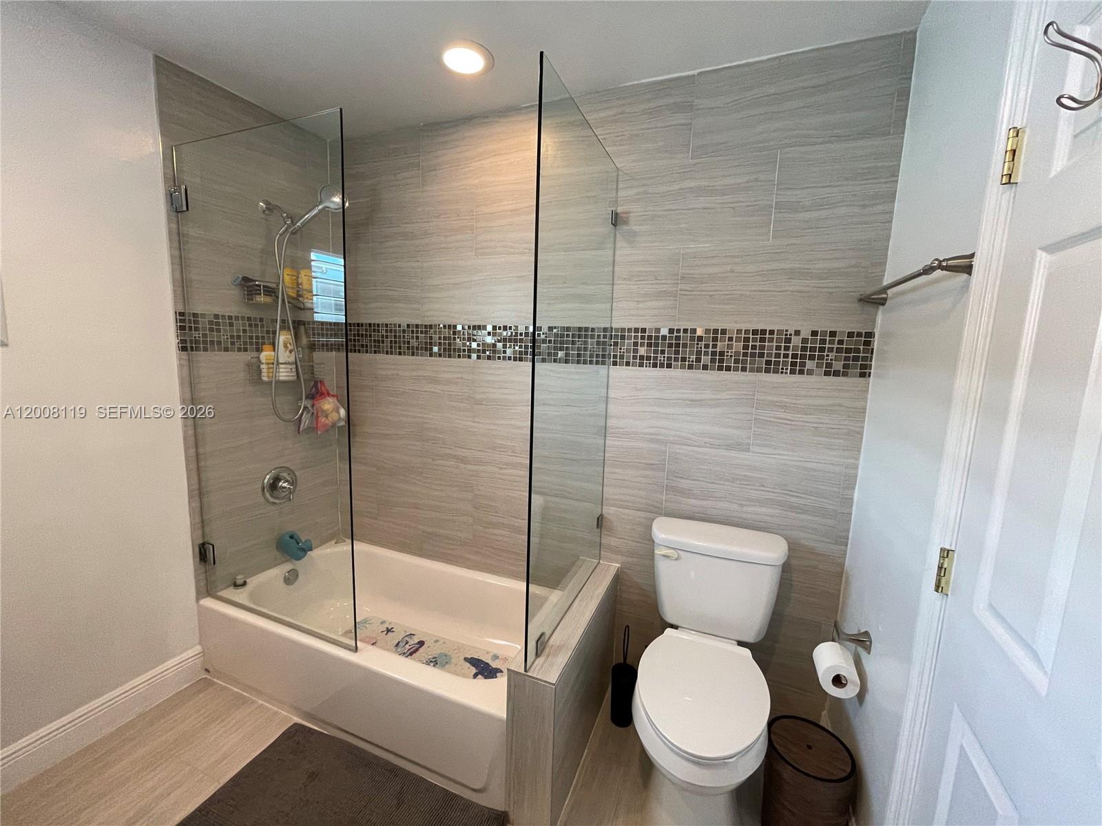 4161 Southwest 102nd Avenue Miami, FL 33165 - Photo 24 of 33 a bathroom with a toilet and a shower