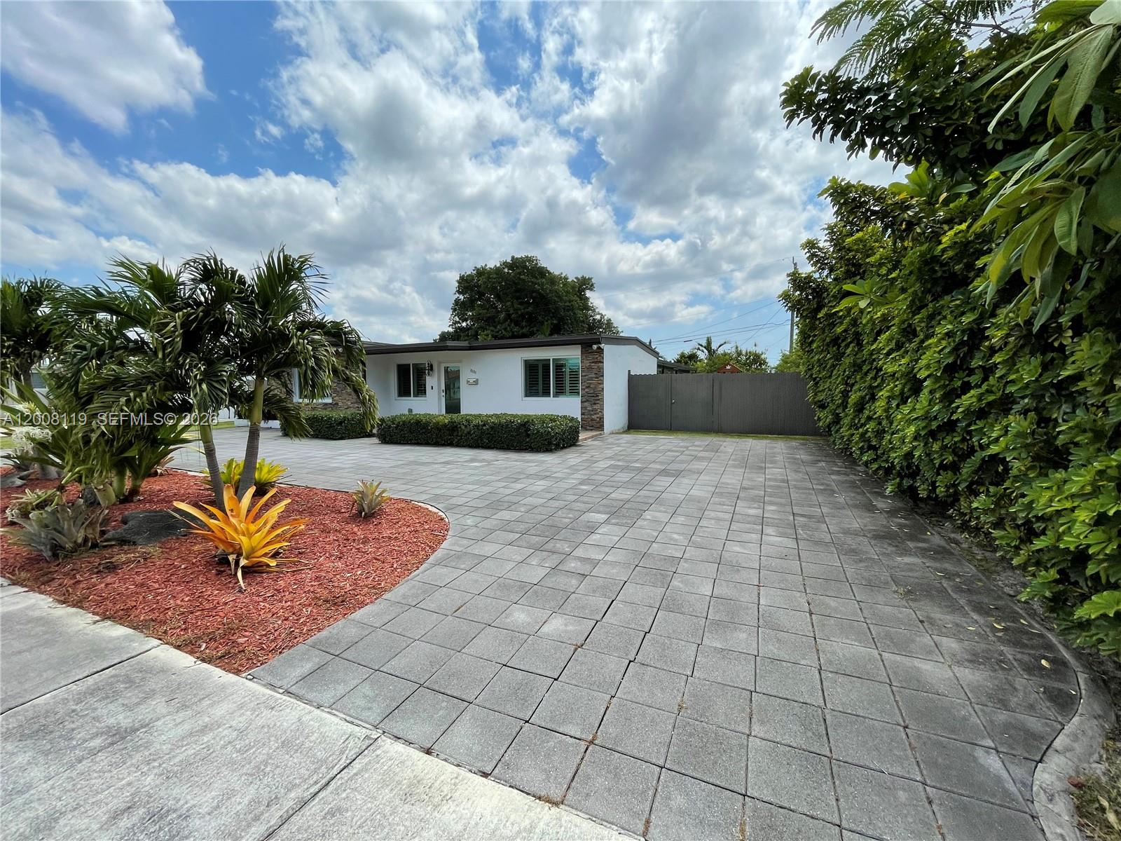 4161 Southwest 102nd Avenue Miami, FL 33165 - Photo 4 of 33 a view of a house with a yard