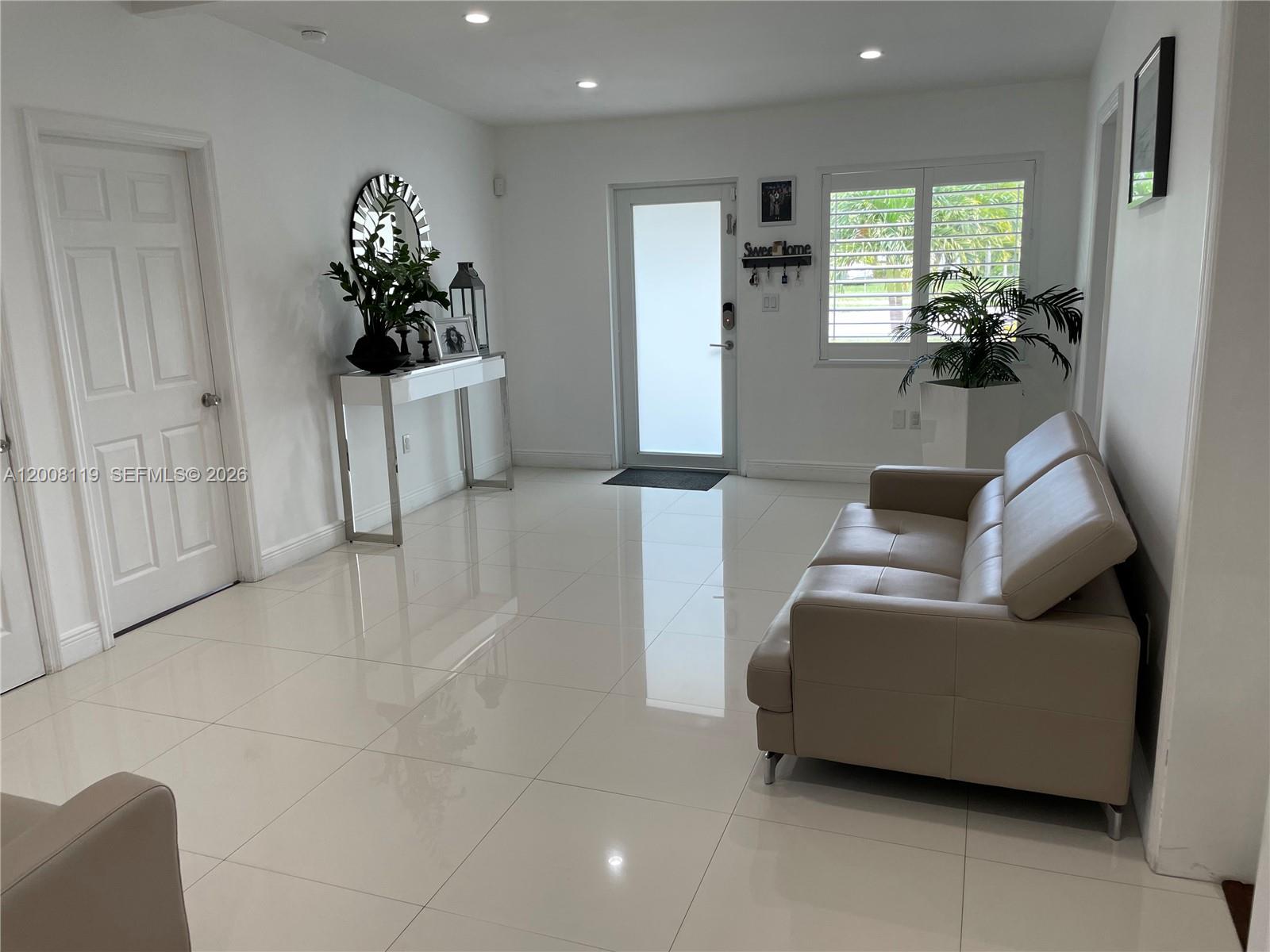 4161 Southwest 102nd Avenue Miami, FL 33165 - Photo 6 of 33 a living room with furniture and a potted plant