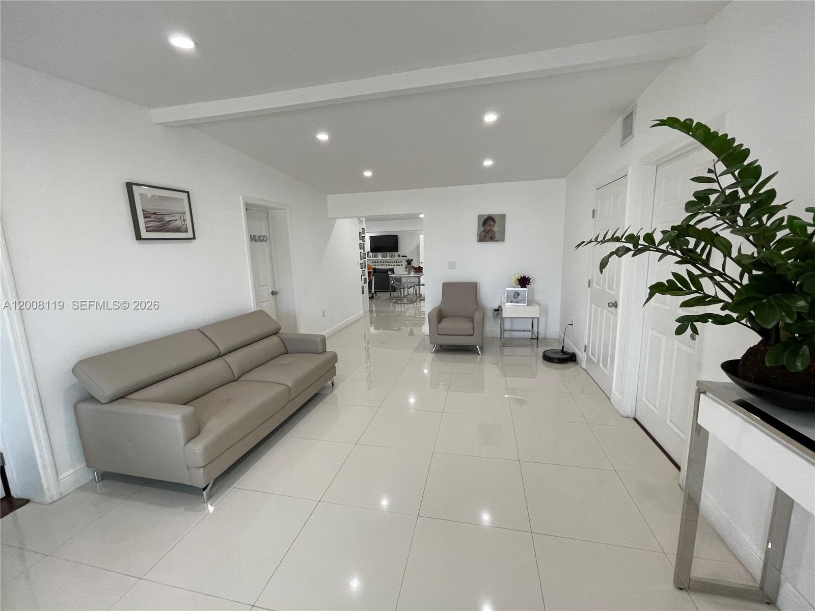 4161 Southwest 102nd Avenue Miami, FL 33165 - Photo 7 of 33 a living room with furniture and potted plant