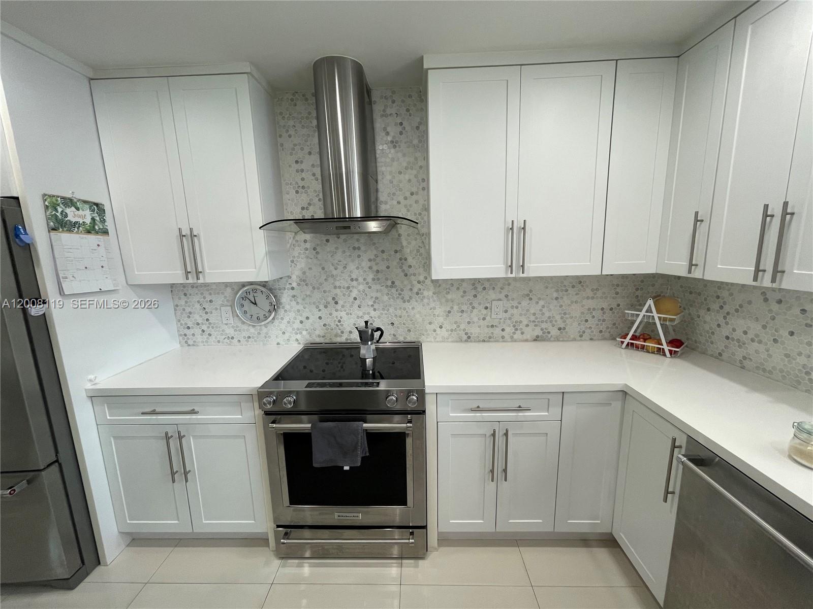 4161 Southwest 102nd Avenue Miami, FL 33165 - Photo 10 of 33 a kitchen with stainless steel appliances granite countertop a sink stove and refrigerator