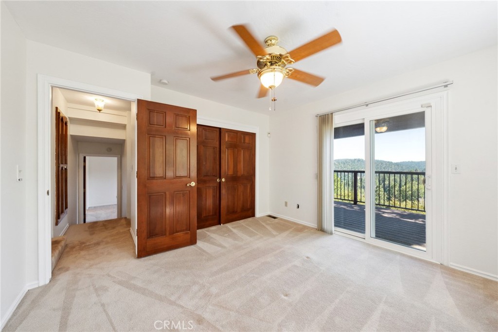 845 Sonoma Drive Lake Arrowhead, CA 92352 - Photo 22 of 49 a view of a livingroom with a chandelier fan and windows