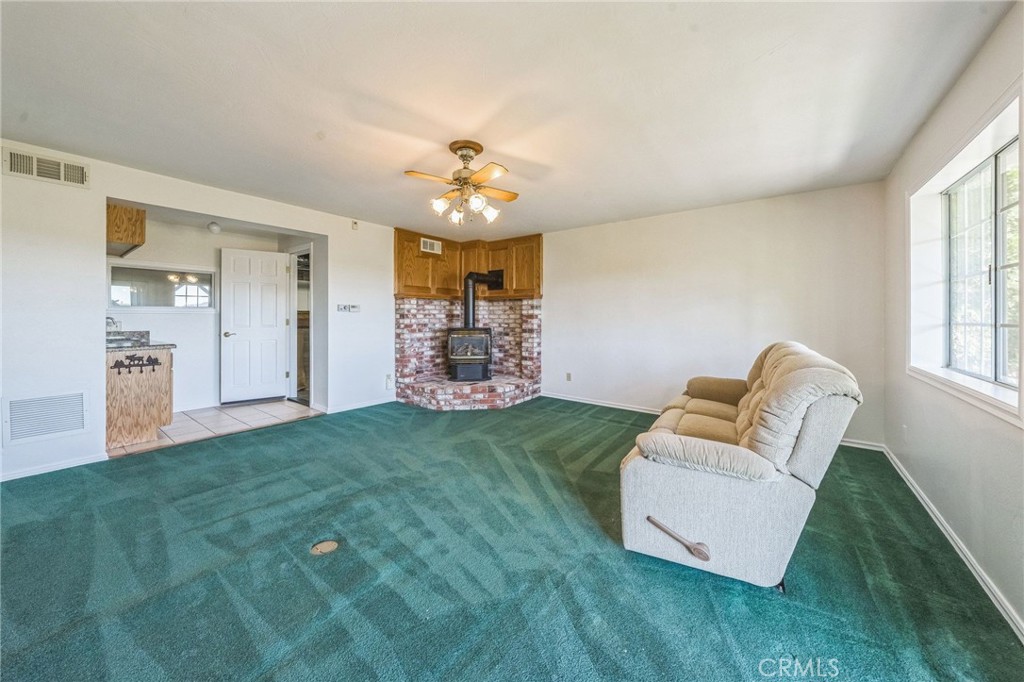 845 Sonoma Drive Lake Arrowhead, CA 92352 - Photo 29 of 49 a living room with furniture and a chandelier