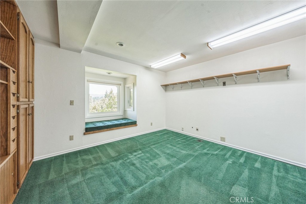 845 Sonoma Drive Lake Arrowhead, CA 92352 - Photo 31 of 49 a view of room with window and hardwood floor