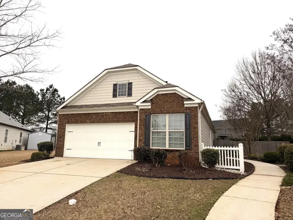 a front view of a house with a garage