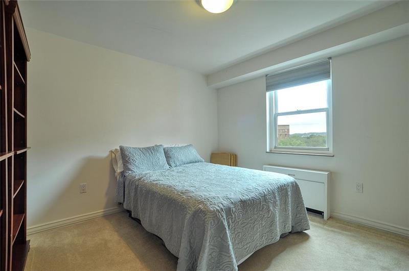 4625 Fifth Avenue, Unit 710 Pittsburgh, PA 15213 - Photo 11 of 12 a bedroom with a bed and a window