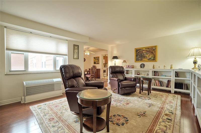 4625 Fifth Avenue, Unit 710 Pittsburgh, PA 15213 - Photo 3 of 12 a living room with furniture and a rug