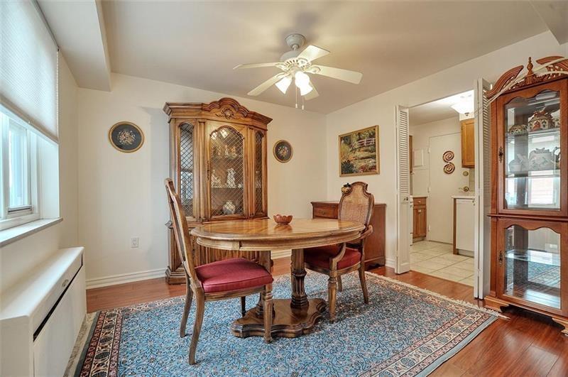 4625 Fifth Avenue, Unit 710 Pittsburgh, PA 15213 - Photo 6 of 12 a view of a dining room with furniture and wooden floor