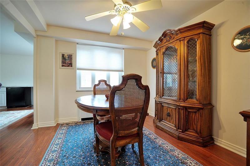 4625 Fifth Avenue, Unit 710 Pittsburgh, PA 15213 - Photo 7 of 12 a view of a workspace with furniture and wooden floor