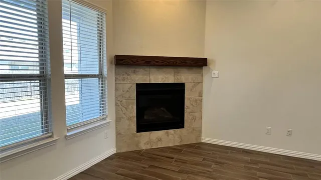 a large kitchen with a hard wood floor