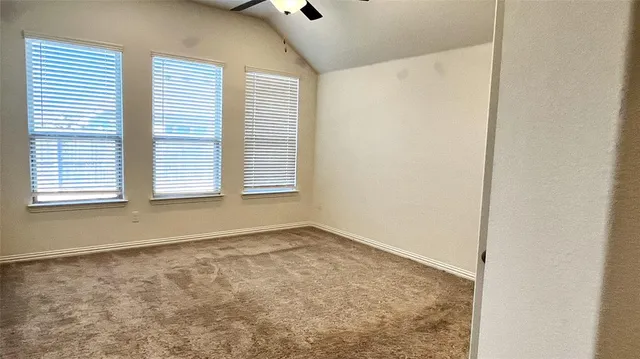 a kitchen with kitchen island a sink appliances and a fireplace