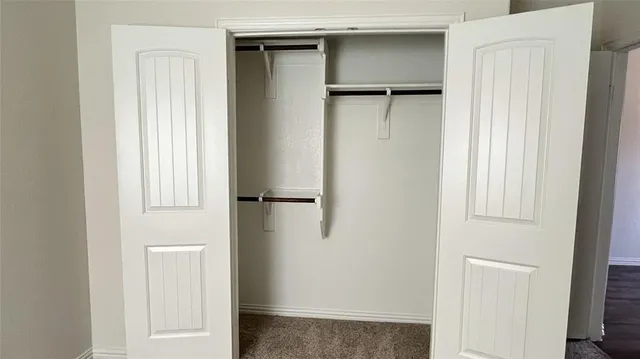 a view of walk in closet with window