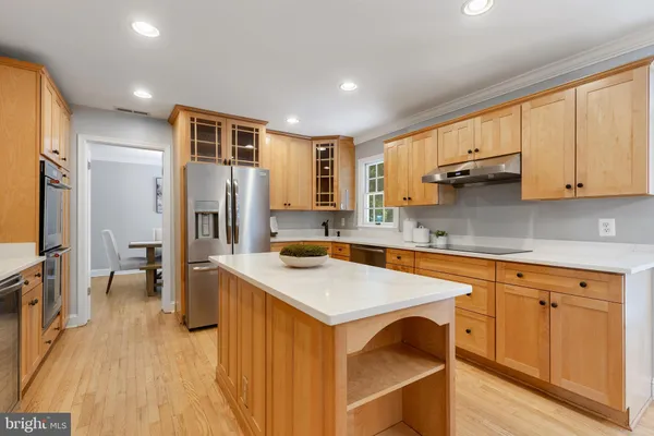 a kitchen with a sink stove and refrigerator