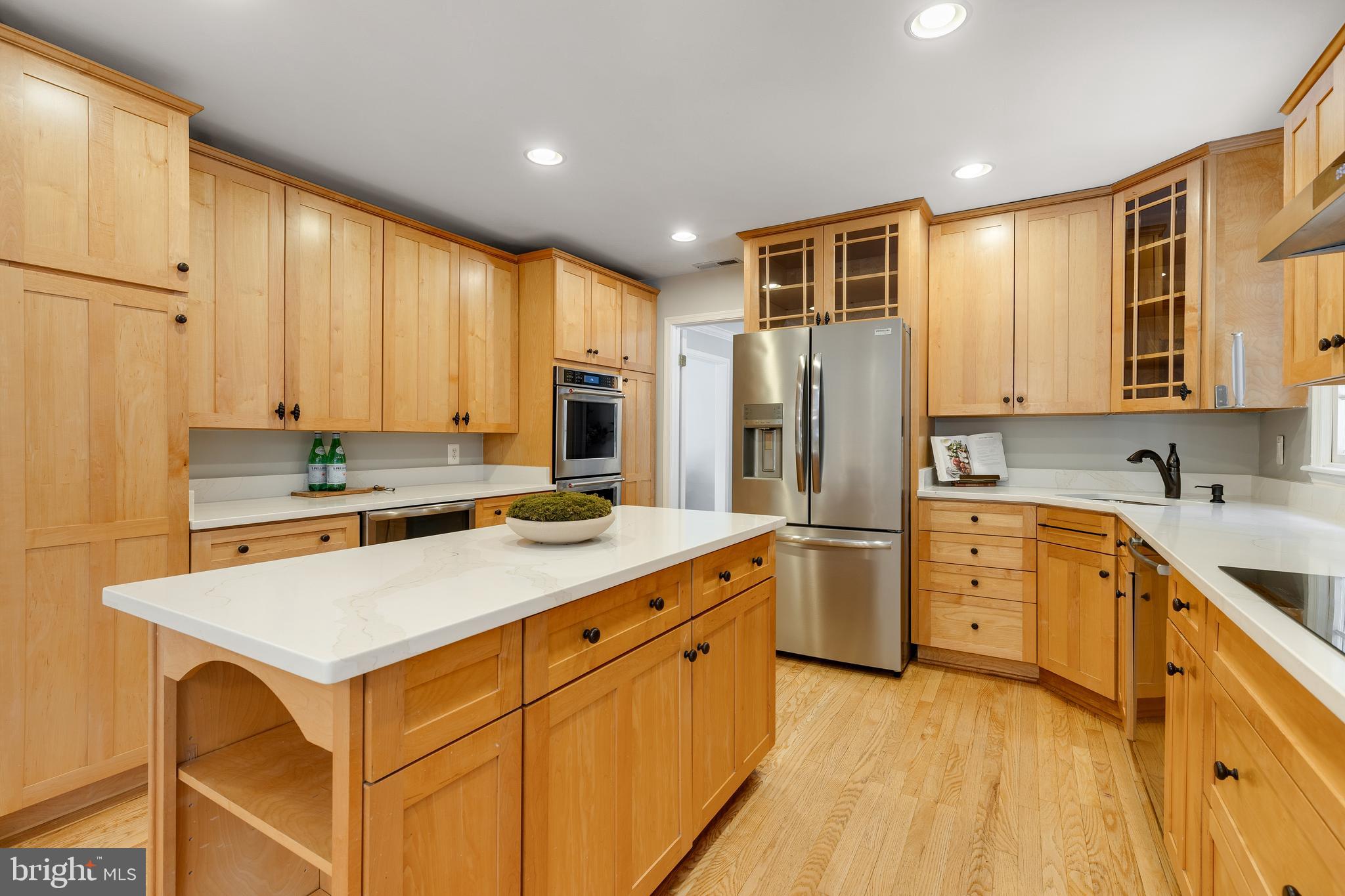 6443 Linway Terrace McLean, VA 22101 - Photo 11 of 53 a kitchen with white cabinets and stainless steel appliances