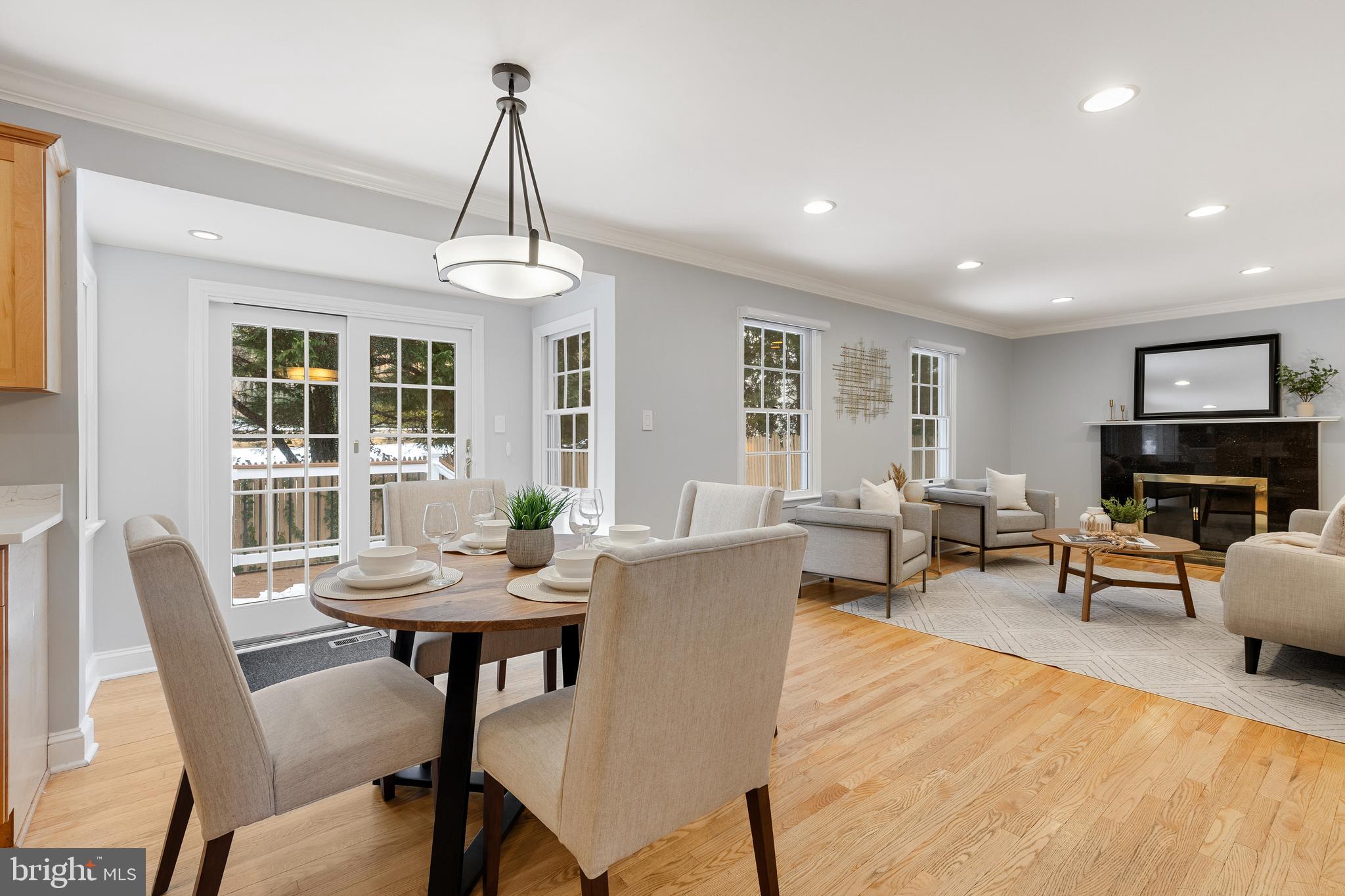 6443 Linway Terrace McLean, VA 22101 - Photo 15 of 53 a living room with furniture a window and a chandelier