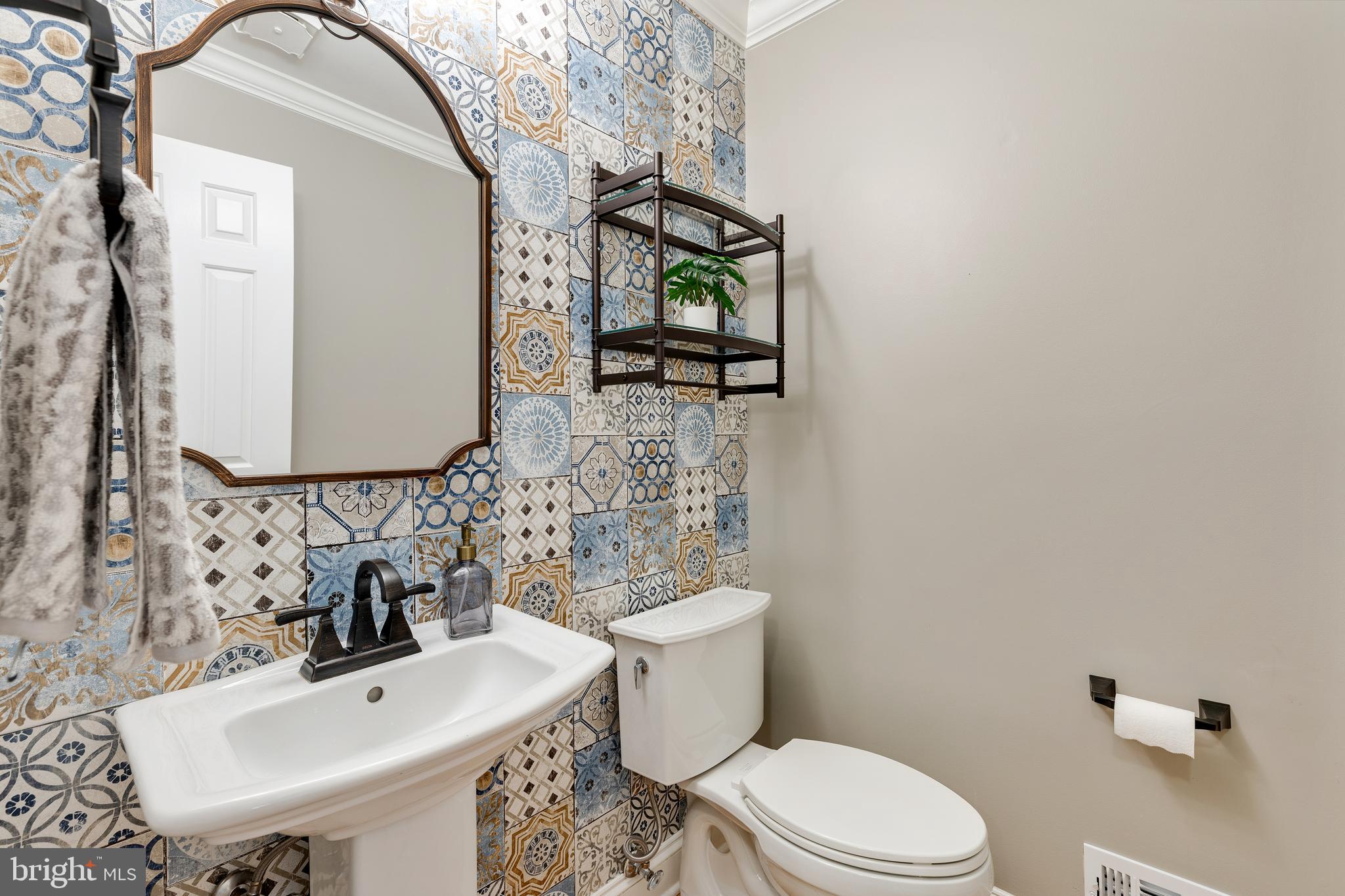 6443 Linway Terrace McLean, VA 22101 - Photo 19 of 53 a bathroom with a sink a toilet and mirror