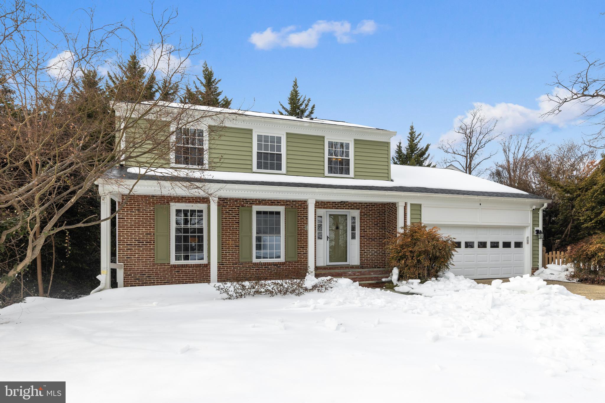 6443 Linway Terrace McLean, VA 22101 - Photo 2 of 53 a front view of a house with a yard and garage
