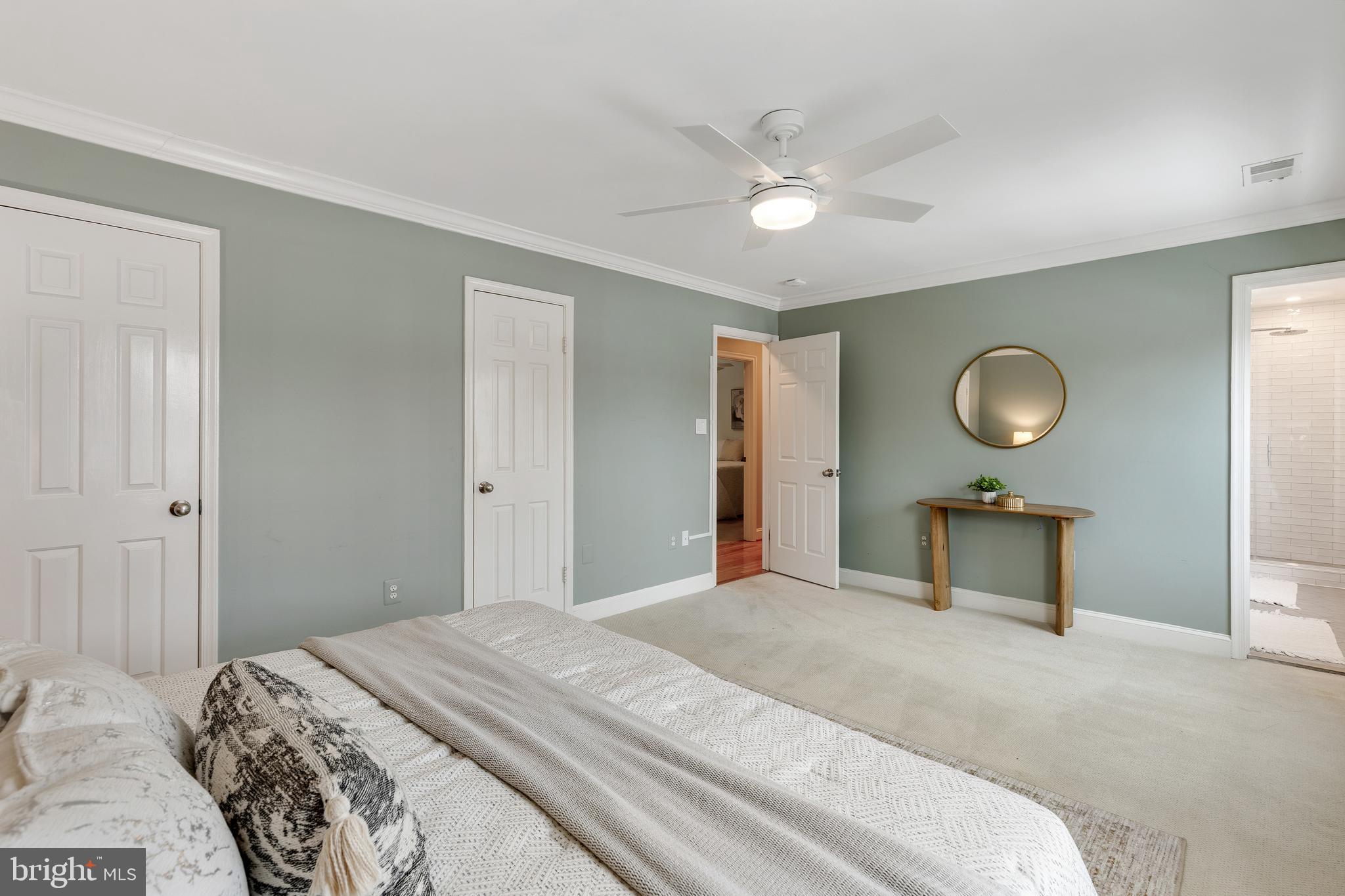 6443 Linway Terrace McLean, VA 22101 - Photo 21 of 53 a bedroom with a bed and a chandelier