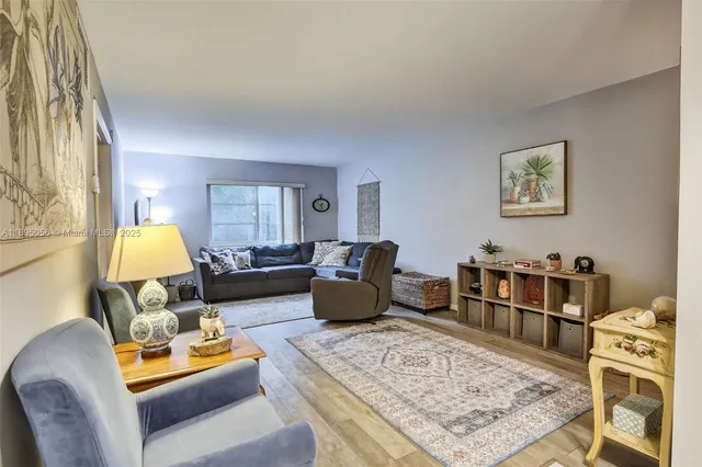 a living room with furniture and a rug