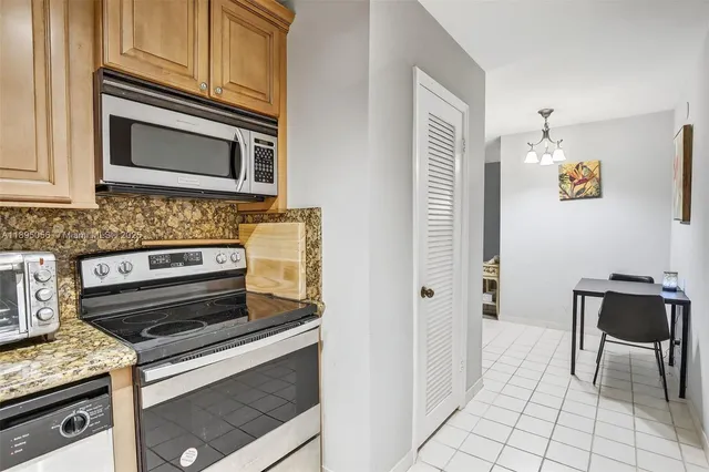 a kitchen with a stove and a microwave