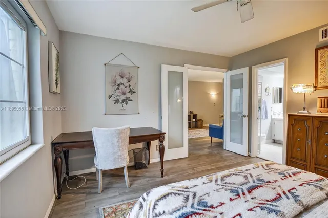 a bedroom with a bed and a table in it