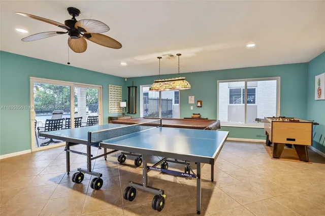 a room with table chairs and a window