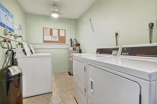 a view of storage and utility room with washer and dryer