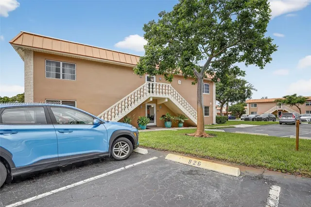 a view of a car parked in front of a house