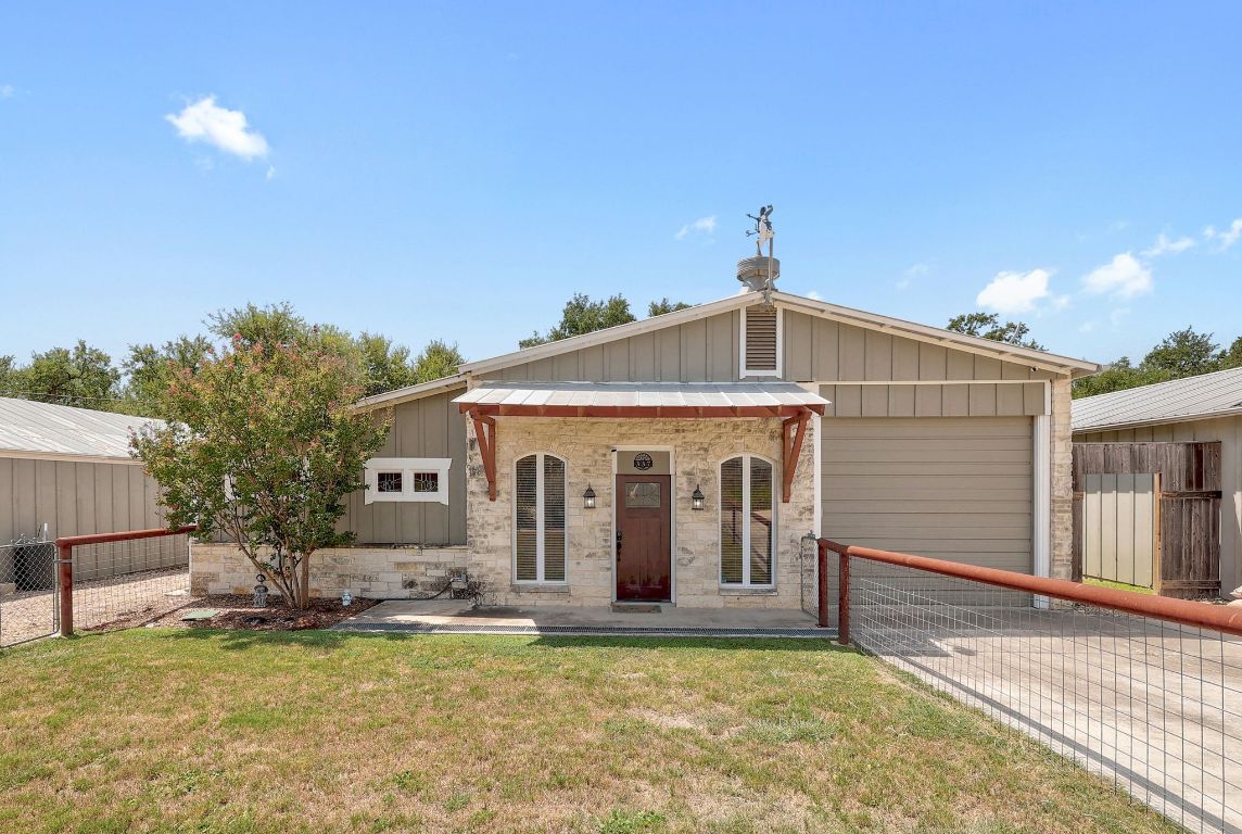 a view of a house with swimming pool in front of it