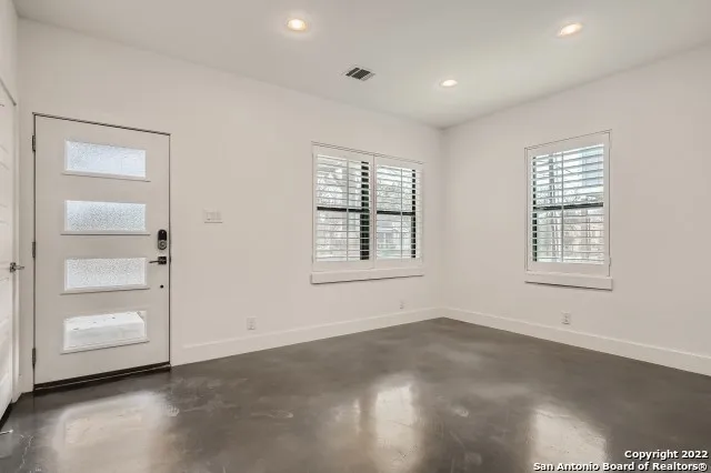 a view of an empty room with a window