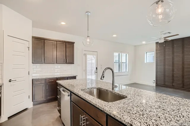 a kitchen with a sink and cabinets